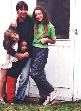 Three sisters with their Dad